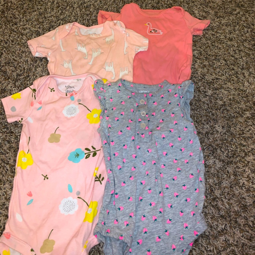 Lot of onesies size 9 months. Carters organic